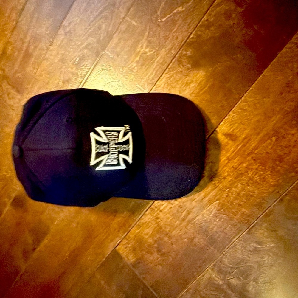 Black and White Hat with Metallic Emblem